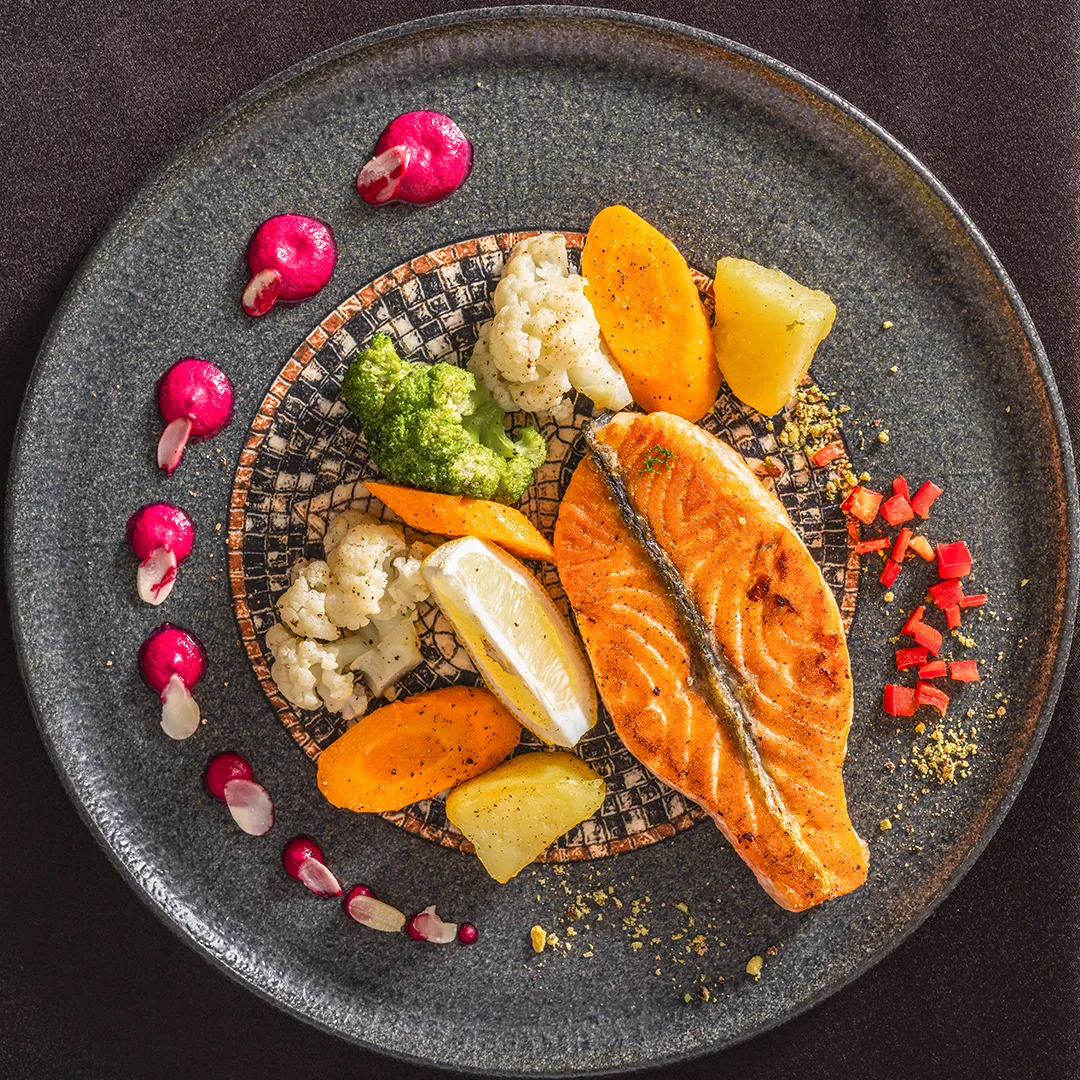Mystic Restaurant plated fish dish with vegetables